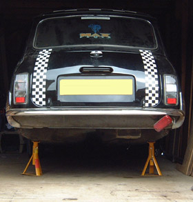 Mini Jacked up and Supported on Axle Stands